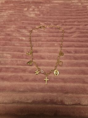Gold Charm Necklace with Cross and Symbolic Pendants